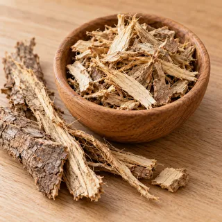 Pale muira puama bark and root chips in a wooden bowl