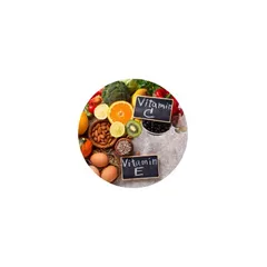 Halved oranges and a handful of almonds, natural sources of vitamins C and E